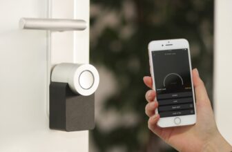 A modern living room with smart home devices like a smart speaker, smart thermostat, and automated lighting, showcasing a seamless integration of technology in everyday life.