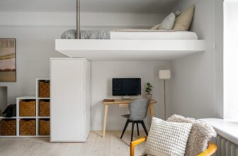 A well-organized small living room with clever storage solutions, showcasing shelves, baskets, and multi-functional furniture.